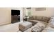 Relaxing living room with a large sectional sofa and ottoman for ultimate comfort at 12704 Leyden St # D, Thornton, CO 80602