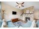 Inviting living room with a stone fireplace and a comfortable seating area at 12704 Leyden St # D, Thornton, CO 80602