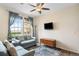 Comfortable living room with a ceiling fan and beautiful views from the large window at 12704 Leyden St # D, Thornton, CO 80602