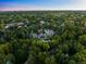 Lush surroundings create a private estate setting with mature landscaping and meticulous grounds at 5 Mockingbird Ln, Cherry Hills Village, CO 80113