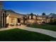 Expansive backyard with an outdoor living area, a fire pit, and lush green lawn, perfect for relaxation at 5 Mockingbird Ln, Cherry Hills Village, CO 80113