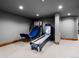Finished basement with a Skee-Ball machine and a basketball hoop for added entertainment at 5 Mockingbird Ln, Cherry Hills Village, CO 80113