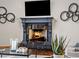 Close-up of fireplace in the living room, with decorative accents and a warm ambiance at 5 Mockingbird Ln, Cherry Hills Village, CO 80113