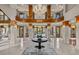 Spacious foyer with marble flooring, a soaring staircase, and elegant chandelier creates a grand entrance at 5 Mockingbird Ln, Cherry Hills Village, CO 80113