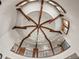 Beautiful foyer with chandelier, beamed ceiling, and wrought iron railing on the second floor at 5 Mockingbird Ln, Cherry Hills Village, CO 80113