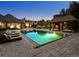 Luxury pool with lounging area and cabana features lush landscaping and an amazing outdoor space at 5 Mockingbird Ln, Cherry Hills Village, CO 80113
