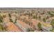 Community aerial view showcasing townhomes, mature trees, and landscaping, providing a serene neighborhood setting at 1981 S Hannibal Ct # B, Aurora, CO 80013