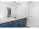 Bathroom featuring a large mirror with vanity lights and storage space underneath at 1981 S Hannibal Ct # B, Aurora, CO 80013
