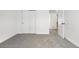 Empty bedroom with plush carpet, large closet, and white trim offers a blank canvas to customize at 1981 S Hannibal Ct # B, Aurora, CO 80013
