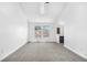 Bright bedroom with two windows providing bright light, light colored carpet and white walls at 1981 S Hannibal Ct # B, Aurora, CO 80013