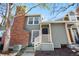 Charming home with red brick chimney, grey siding, and inviting front entry at 1981 S Hannibal Ct # B, Aurora, CO 80013