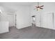 Carpeted hallway with a fan and multiple doors leading to other rooms at 1981 S Hannibal Ct # B, Aurora, CO 80013