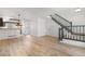 Inviting living room featuring hardwood floors and open staircase access at 1981 S Hannibal Ct # B, Aurora, CO 80013