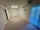 Basement room with sliding glass doors to outside at 1469 S Ulster St, Denver, CO 80231