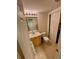 Bathroom featuring tile floor, toilet and vanity at 1469 S Ulster St, Denver, CO 80231