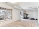 Bright bedroom featuring neutral carpeting, a window, closet space and a treadmill at 1469 S Ulster St, Denver, CO 80231