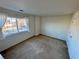 Bright bedroom with a large window, carpet flooring, and ample space at 1469 S Ulster St, Denver, CO 80231