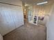 Hallway featuring carpet, a skylight, and closet space at 1469 S Ulster St, Denver, CO 80231