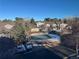 Community pool with covered for winter, surrounded by trees and nearby townhomes at 1469 S Ulster St, Denver, CO 80231