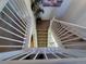 View from above, looking down on the white stairwell at 1469 S Ulster St, Denver, CO 80231