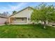 A well-manicured lawn and concrete patio create an inviting outdoor space at 3930 Miller St, Wheat Ridge, CO 80033