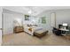 Cozy bedroom showcasing a comfy bed, soft carpet, and vaulted ceiling with a fan at 3930 Miller St, Wheat Ridge, CO 80033