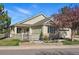Charming single-story home with manicured lawn and inviting front porch with tasteful landscaping at 3930 Miller St, Wheat Ridge, CO 80033