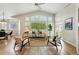 Bright and airy living room featuring vaulted ceilings, large windows, and stylish contemporary furnishings at 3930 Miller St, Wheat Ridge, CO 80033