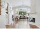 Spacious living room with hardwood floors, high ceilings, a fireplace, and lots of natural light at 3930 Miller St, Wheat Ridge, CO 80033