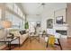 Bright living room showcasing vaulted ceilings, large windows, and comfortable seating at 3930 Miller St, Wheat Ridge, CO 80033