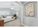 Serene main bedroom with a ceiling fan, a decorative piece, and a cozy chair at 3930 Miller St, Wheat Ridge, CO 80033