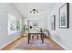Well-lit home office with a desk, comfortable chair, and large window offering natural light at 3930 Miller St, Wheat Ridge, CO 80033