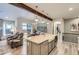 Modern kitchen with white cabinets and large island at 11798 Barrentine Loop, Parker, CO 80138