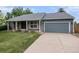 Charming single-Gathering home featuring a well-manicured front yard and two car garage at 523 E Long Ct, Littleton, CO 80122