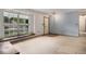 Bright living room with large window and plush carpeting, and natural light at 523 E Long Ct, Littleton, CO 80122
