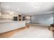 Open concept living area with views to the kitchen and fireplace at 523 E Long Ct, Littleton, CO 80122