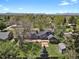 Aerial view of the property showing the spacious backyard, patio area, and surrounding landscape with trees at 440 Balsam St, Lakewood, CO 80226