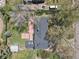 Drone image of a house, showing an outdoor fireplace, shed, and back of the home at 440 Balsam St, Lakewood, CO 80226