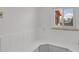 Bright basement featuring white wainscotting and a window for natural light at 440 Balsam St, Lakewood, CO 80226