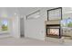 Finished basement featuring a modern fireplace with tile surround at 440 Balsam St, Lakewood, CO 80226