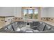 Relaxing bathroom with a luxurious whirlpool tub and bay window at 440 Balsam St, Lakewood, CO 80226