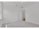 Bedroom with white walls, neutral carpet, and closet space at 440 Balsam St, Lakewood, CO 80226