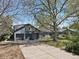 Charming home with a two-car garage and a spacious front yard, perfect for outdoor activities at 440 Balsam St, Lakewood, CO 80226
