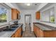 Eat-in kitchen featuring granite countertops, a tiled floor, and stainless steel appliances at 440 Balsam St, Lakewood, CO 80226