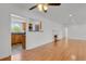 Bright living room showing open floor plan to kitchen and fireplace at 440 Balsam St, Lakewood, CO 80226