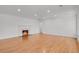 Bright living room featuring a cozy fireplace and wood-look floors at 440 Balsam St, Lakewood, CO 80226