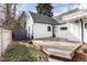 Spacious backyard deck with attached shed and surrounding fence at 9393 W 14Th Ave, Lakewood, CO 80215