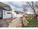 View of backyard deck, showing a portion of the house and yard at 9393 W 14Th Ave, Lakewood, CO 80215