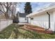 View of backyard including deck, shed, and landscaping at 9393 W 14Th Ave, Lakewood, CO 80215