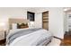 Well-lit bedroom with built-in closet and plush bedding at 9393 W 14Th Ave, Lakewood, CO 80215